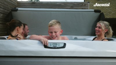 Family Enjoying Being in a Jacuzzi